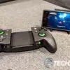 The PowerA MOGA XP7-X Plus mobile game controller for Android and PC with smartphone on game stand