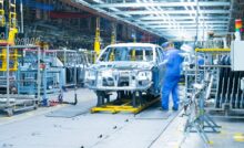 Car production line, workers are working.
