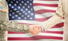 Soldier and businessman shaking hands